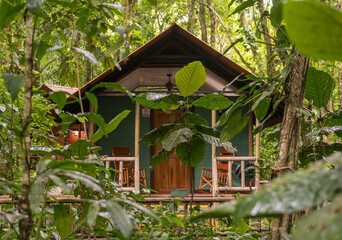 Wooden cabins with balcony and deck in nature resort in Costa Rica rainforest