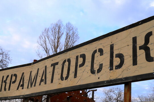 A road sign with Ukrainian inscriptions - Kramatorsk, Donetsk Region, damaged by bullets during Russia s war against Ukraine in Donbas.
