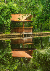 Wooden patio deck structure on waterfront in nature resort in Tortuguero National Park Costa Rica rainforest