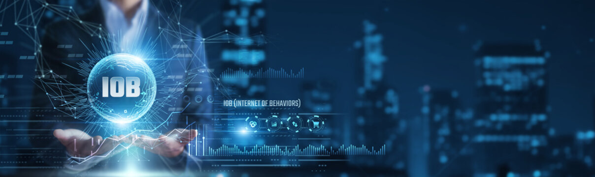 Businessman hands holding internet of behaviors analytics and user data, behavioral insights, digital interaction intelligence concept