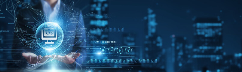 Businessman hands holding web development and coding data, website creation workflow, modern internet technology concept © Shevon