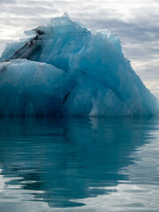 Blue iceberg with crystal structure floating in Iceland's Jokulsarlon Glacier Lagoon