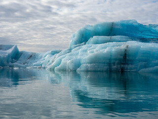 Blue iceberg with crystal structure floating in Iceland's Jokulsarlon Glacier Lagoon