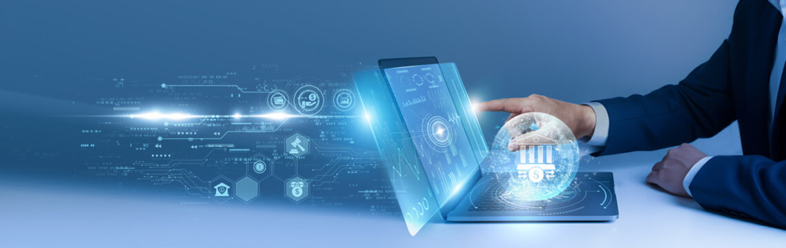 Businessman using laptop and analyze the corporate banking data on digital interface. financial services, enterprise finance, digital banking, business account, economic analysis