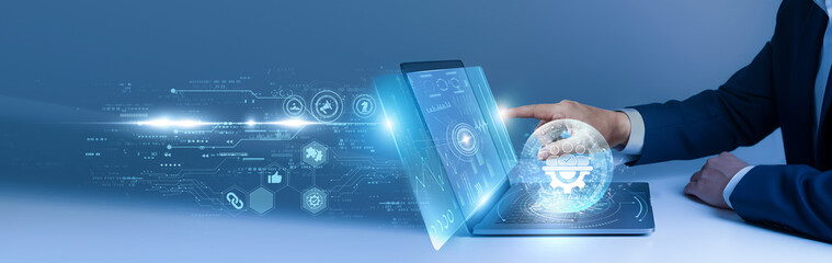 Businessman using laptop and analyze the project management dashboard on digital interface. task...