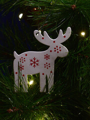 White Wooden Reindeer Ornament on Christmas Tree