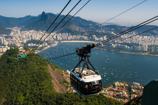 Sugarloaf cable car cabin over Rio de Janeiro with panoramic city and ocean view, Brazil