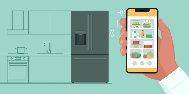 Man connecting his phone to a smart fridge at home