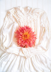 Large dinnerplate dahlia and an antique dress.
