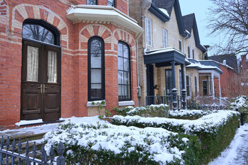 Residential street with old houses with gables in winter