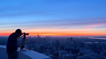 Capturing a vibrant city sunset transitioning to night skyline: urban photography journey