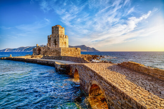 The Venetian Fortress of Methoni with Bourtzi Tower in Peloponnese, Messenia, Greece, during sunset time