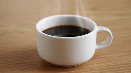 Steaming coffee cup on wooden table: cozy morning vibes and relaxation