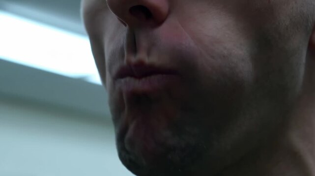 Closeup sequence of a person chewing in slow motion capturing facial movements
