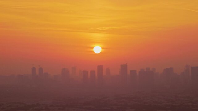 Sunrise over Dubai skyline, skyscrapers in morning glow, urban landscape, modern architecture. Aerial 4K drone video footage of golden hour and Dubai sunset