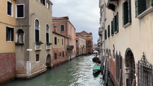 Venice canals with historical buildings and boats, winter day in Italian city