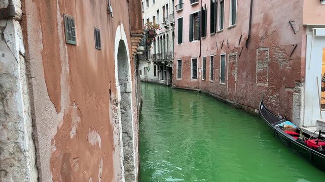 Venice, Rio dei Barcaroli canal with gondola and historic facades near San Marco