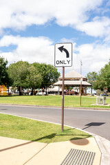 left turn only road sign