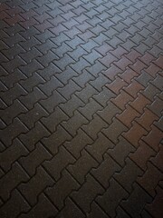 Abstract background of tiles on pavement at night