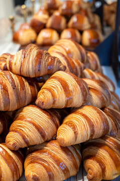 Breakfast in France, fresh baked butter croissants pastries in artisanal bakery in Paris, France, close up