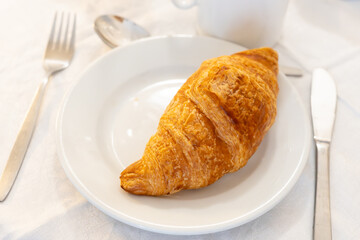 Breakfast in France, fresh baked butter croissants pastries in artisanal bakery in Paris, France, close up