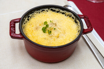 High cuisine cooking experince with chef in cook studio in Paris, oven baked vegetarian dish with vegetables, truffle mushrooms, cheese, black salsify, mousse and nuts