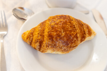 Breakfast in France, fresh baked butter croissants pastries in artisanal bakery in Paris, France, close up