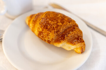 Breakfast in France, fresh baked butter croissants pastries in artisanal bakery in Paris, France, close up
