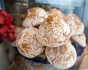 Meringue on display in confectionery shop, type of dessert or candy, of French origin, traditionally made from whipped eggwhites and sugar, Paris