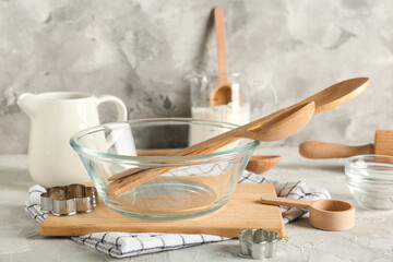 Different baking utensils and flour on grunge table