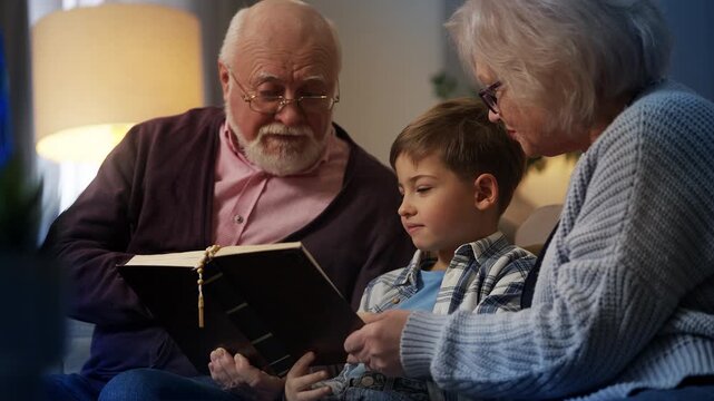 Grandparents teaching grandson Bible stories, reading Holy Scripture together