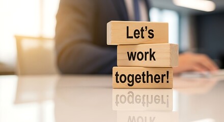 Lets Work Together Wooden Blocks on a Desk.