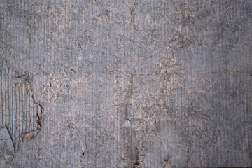 Imagen horizontal del suelo de cemento gris con grietas y viejo ideal para texturas