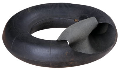 Torn inner tube from a small diameter tire. Isolated background.