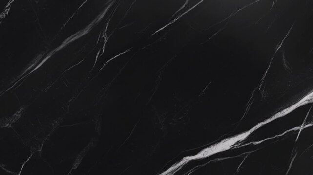 Elegant and modern black marble, perfect for use as a backdrop for interior design, high-end product marketing materials, or graphic elements requiring a minimalist aesthetic.