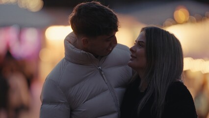 A romantic young couple in Paris France are looking at each other with love and affection during...