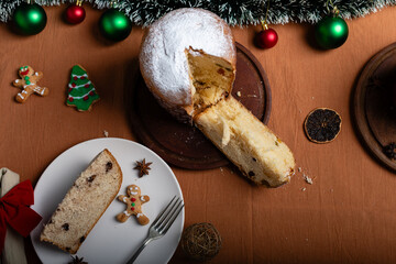 Top view of a panettone on a Christmas table.