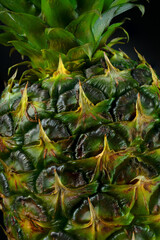Obraz premium Macro Texture of Pineapple Skin and Leaves