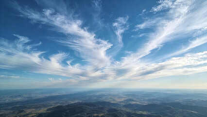 A bright blue sky scattered with wispy, delicate clouds. Clouds, Cirrus clouds, Stratus clouds, Cumulus clouds, Cloud