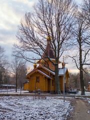 Traditional Wooden Orthodox Church with Golden Domes in Winter