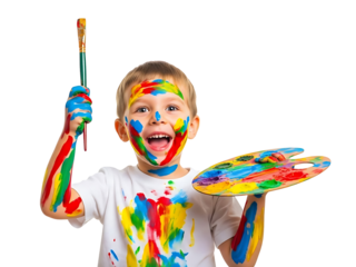 A young boy enthusiastically holding a paintbrush and palette, covered in colorful paint splatters, against a clean white background