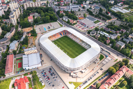 Aerial view of Stadion Miejski in Bielsko-Biała, Silesian Voivodeship, Poland&mdash;modern football stadium of Podbeskidzie FC, surrounded by residential neighborhoods and city skyline