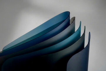 Abstract arrangement of curved translucent blue and teal panels image photo
