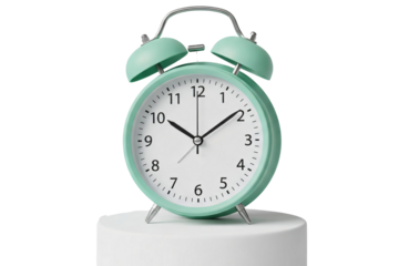 Mint green alarm clock on a white pedestal isolated on transparent background