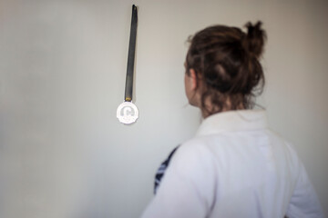 Jiu-jitsu fighter looking at his first medal