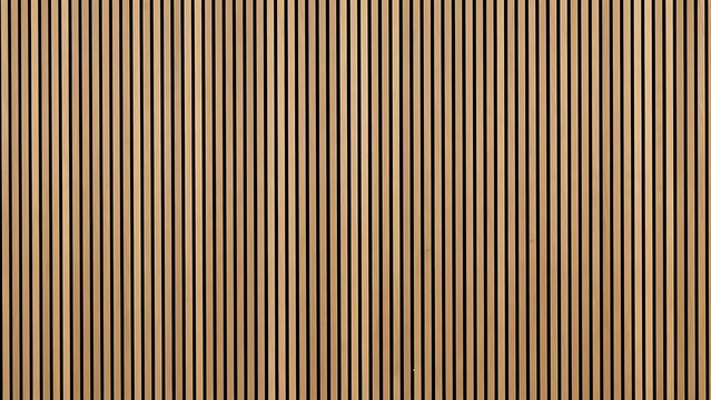 Abstract background of vertical wooden slats with a natural wood grain texture creating a warm and organic surface pattern