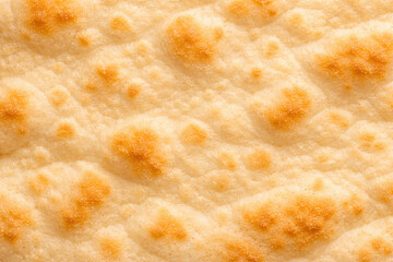 ナンの焼き面のマクロ質感背景