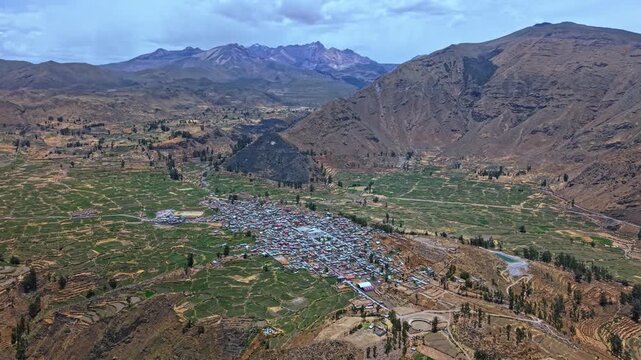 On the edge of the famous Colca Canyon lies the small rural town of Cabanacode, Colombia. Circling drone footage captures surrounding mountains emphasising the towns remoteness and isolation