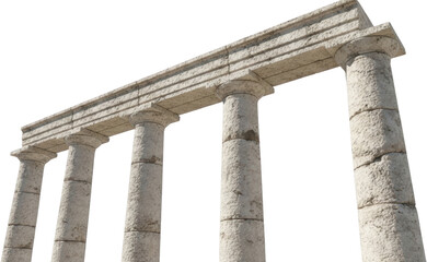 Fototapeta premium Row of ancient weathered stone columns supporting a classical entablature structure isolated on a dark background suggesting classical architecture remains Ruins Pillar Building Temple