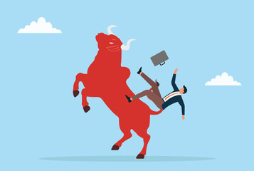 Vector illustration of a businessman losing balance on a red bull, illustrating market turbulence, financial risk, and unstable investments
